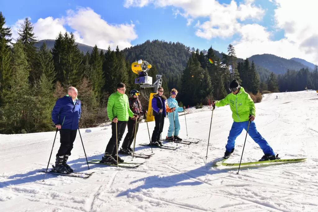 Ski lessons for beginners, showing the snow plough