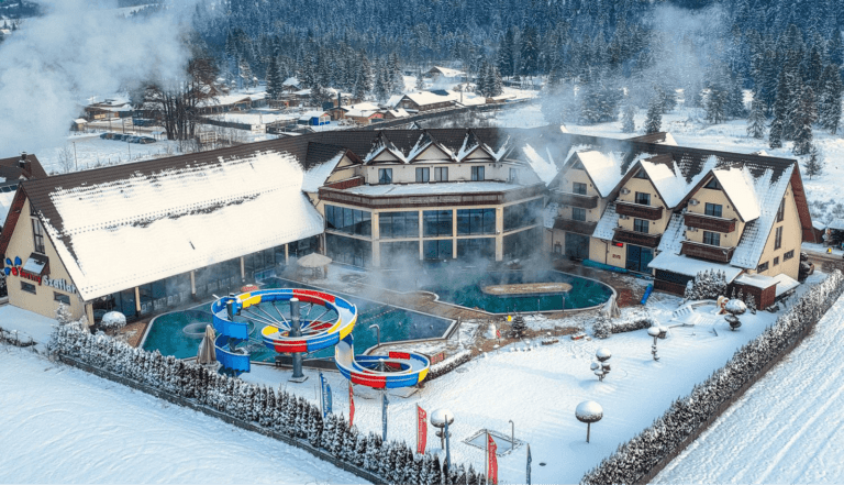 Thermal baths complex with an outside pool and twisting slides during winter